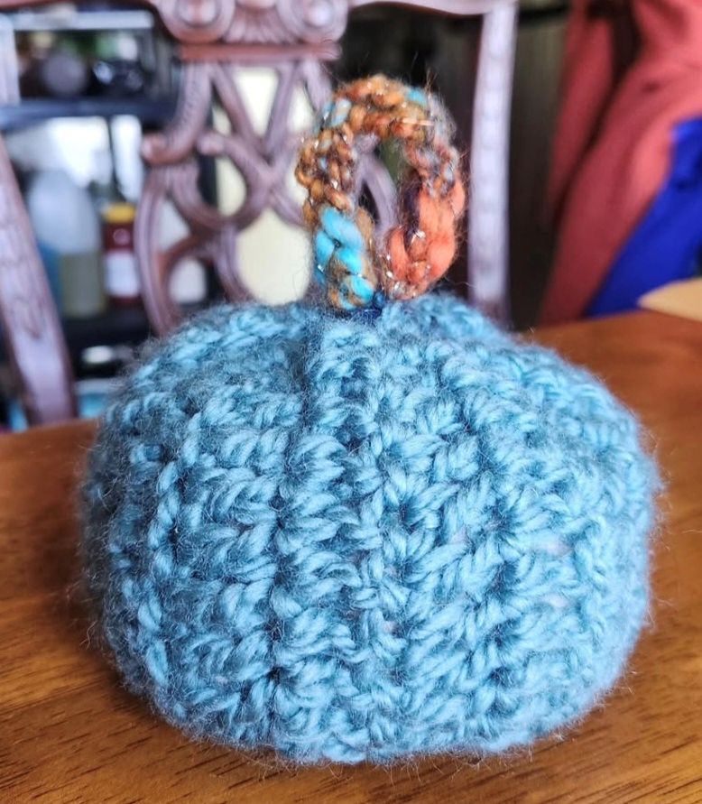 a blue crocheted pumpkin